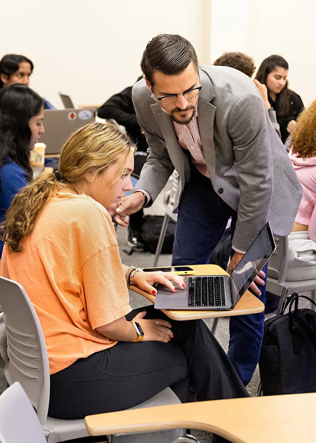 A professor working with a student.